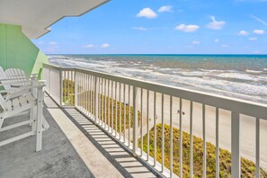 A balcony with a view of the ocean, a pier, and a green wall. - Premier resort offering deluxe oceanfront condos in the heart of family-friendly North Myrtle Beach (North Myrtle Beach)