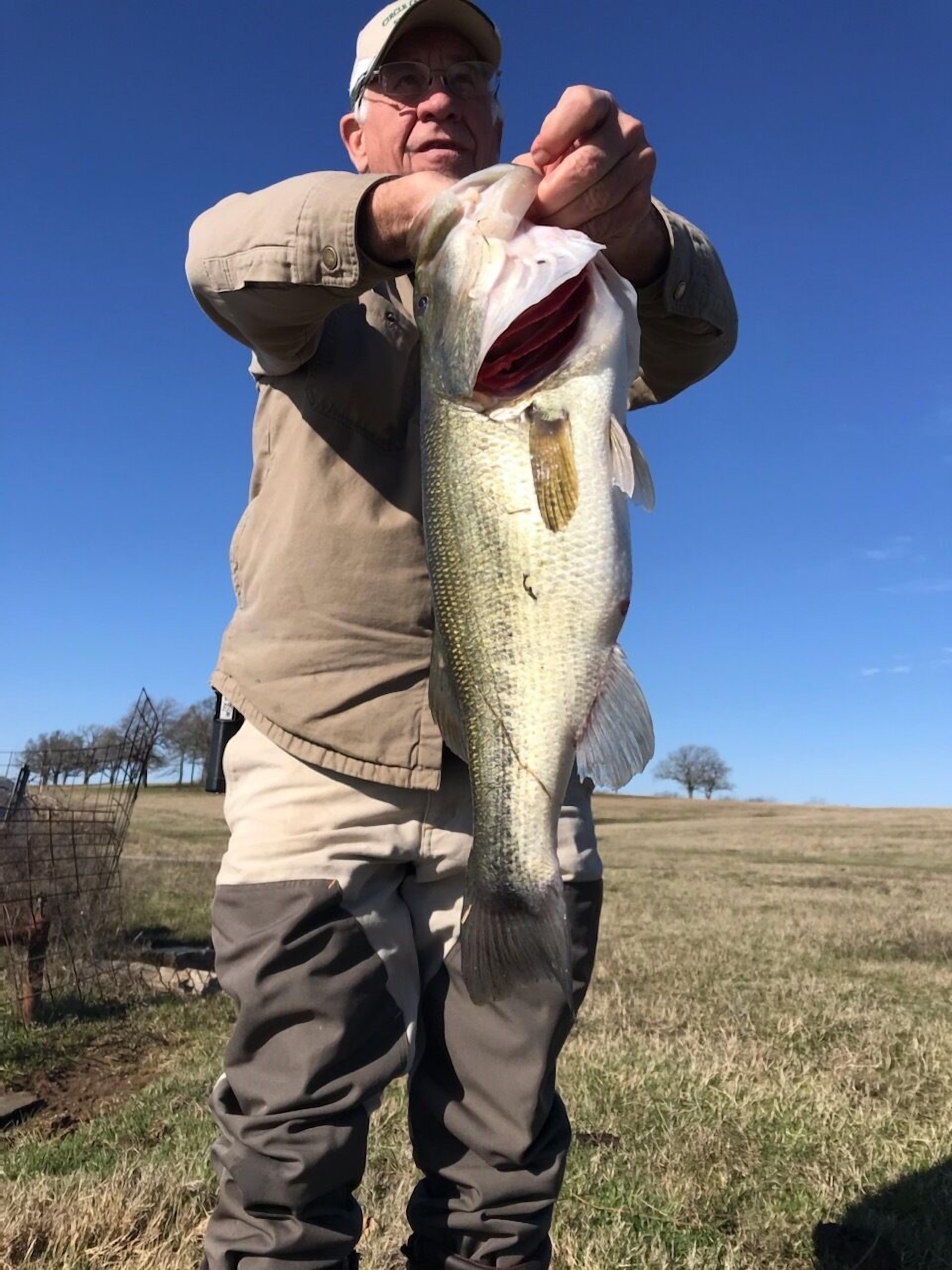 A person holding a large fish.