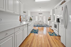 Enjoy meals in the kitchen with a dining area and refrigerator.