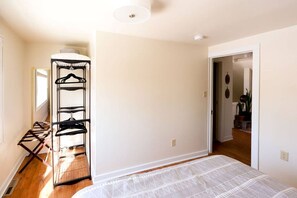 Sleep in comfort on the large bed in this minimalist bedroom.