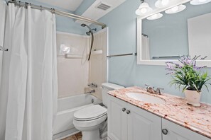 Combined shower/tub, hair dryer, towels - Charming Condo Steps from the Beach with Pool, Sundeck, and Stunning Views in Vibrant Cherry Grove! (North Myrtle Beach)