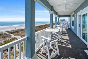 Outdoor dining - Vacation in style! Beautiful oceanfront home w/priv pool, game room, complete vacay & fun paradise (North Myrtle Beach)