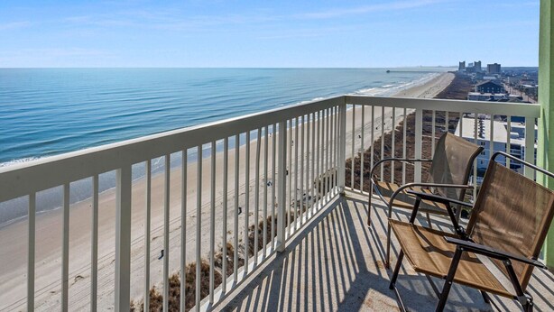 A balcony with a view of the beach and ocean. - Your Ultimate Oceanfront Escape! (North Myrtle Beach)