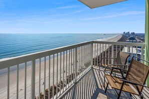 A balcony with a view of the beach and ocean. - Your Ultimate Oceanfront Escape! (North Myrtle Beach)