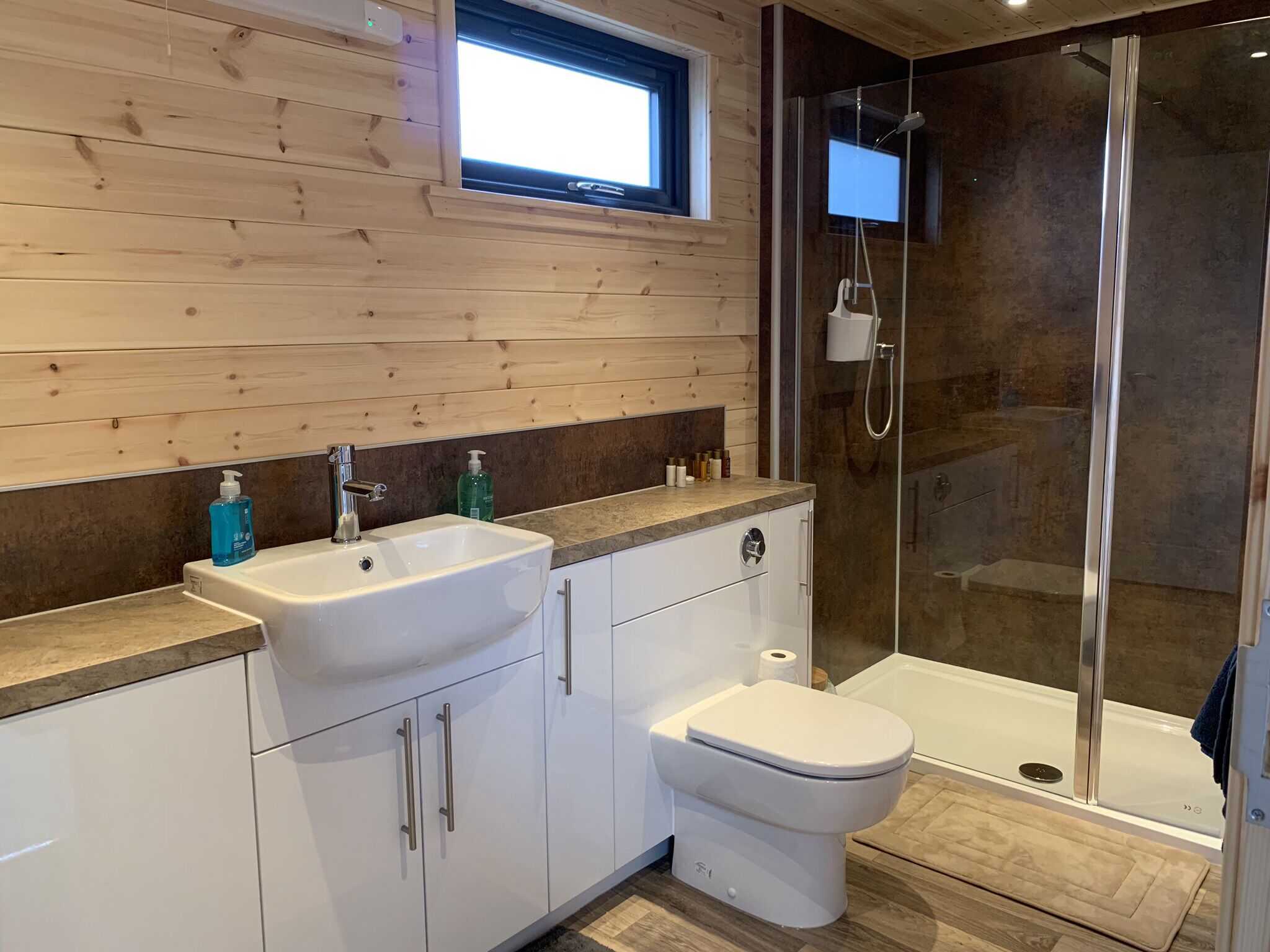 Shower, hair dryer, towels, toilet paper