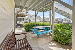 Relax in a serene outdoor space surrounded by lush greenery and residential views.