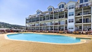 A multi-story hotel with a pool area. - 4BR/3BA Lakefront Penthouse, Clearwater Condominiums<br>Sleeps 8 (Camdenton)