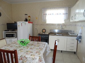 Apartment, 2 Bedrooms | Private kitchen | Fridge, microwave, stovetop, cookware/dishes/utensils