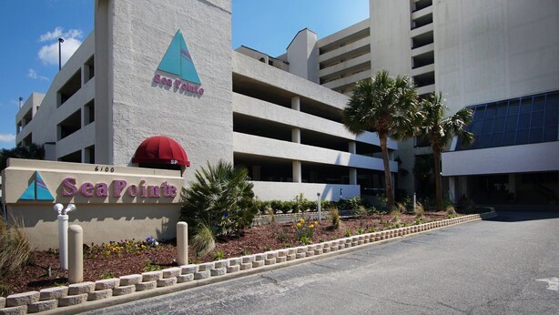 A multi-story parking garage with a sign for 'SeaPoint' hotel.
