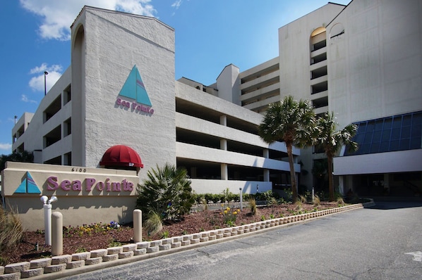 A multi-story parking garage with a sign for 'SeaPoint' hotel.