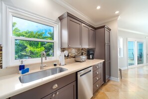 Fridge, microwave, oven, dishwasher - Fishermen`s Paradise | Waterfront home with huge pool, 220-foot dock & gorgeous interior (Big Pine Key)