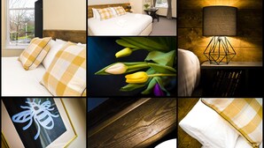 A hotel room with a bed, a desk, a lamp, and a view of the outdoors. - Bowling Green (Manchester)