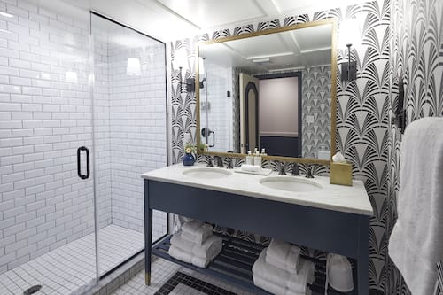 Designer toiletries, hair dryer, bathrobes, towels