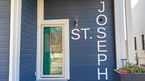 A building entrance with a nameplate reading "JOSEPH ST."