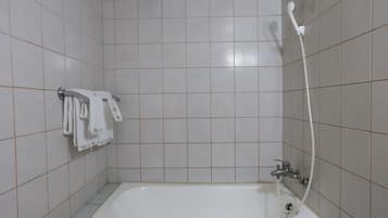 Combined shower/bathtub, hair dryer, towels, soap