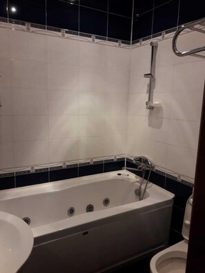 Family Apartment | Bathroom | Separate bathtub and shower, hair dryer, slippers, towels