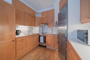 Apartment, 1 Bedroom | Private kitchen | Fridge, microwave, oven, stovetop - HVC Apartments Museokatu 44 (Helsinki)