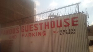 A corrugated metal structure with a sign that reads "FAMOUS GUESTHOUSE AND PARKING." - Famouse Guest House (Nairobi)