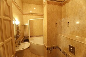 Combined shower/tub, jetted tub, hair dryer, bathrobes