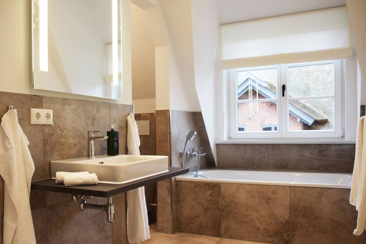 double room, garden view | bathroom | hair dryer, slippers, towels, soap