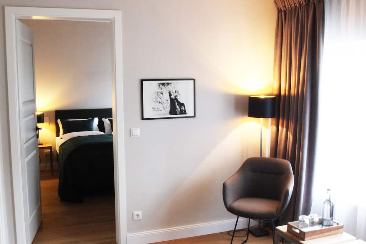 double room, garden view | living area | flat-screen tv