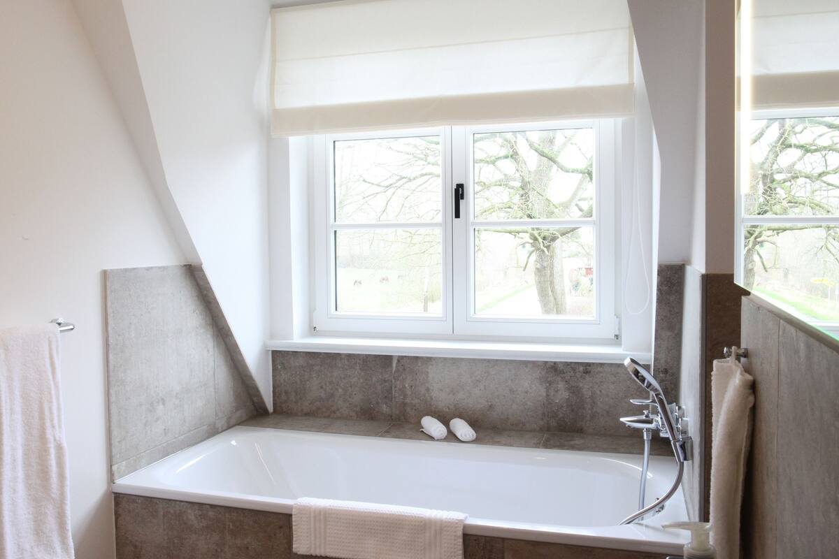 double room, garden view | bathroom | hair dryer, slippers, towels, soap