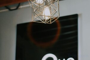 A geometric light fixture with a bulb.