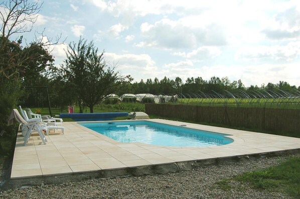 Seasonal outdoor pool, pool umbrellas, pool loungers