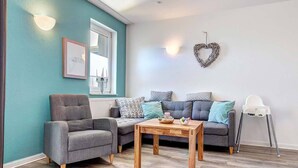 Apartment, Balcony (Ostseeglueck) | Living area | 120-cm LED TV with cable channels, TV, DVD player - Residenz Waldhaus (Zempin)