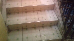 A staircase with patterned tiles and a metal railing. - Soulfa Guest House (Nairobi)