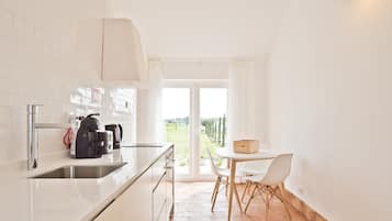 Casa, 1 habitación, vista al jardín | Cocina privada | Periquera