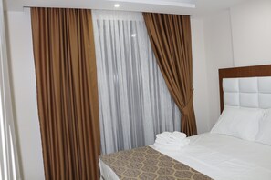 Suite Deluxe | 1 dormitorio, decoración individual, wifi gratis y ropa de cama