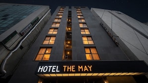 A hotel named 'HOTEL THE MAY' with a modern facade and illuminated windows. - The May Hotel (Seoul)