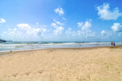 Spacious condo w/ shared pool, balcony, free WiFi, & walk to beach