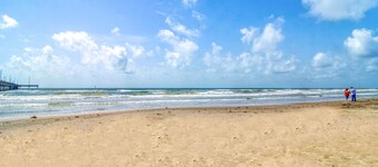 Spacious condo w/ shared pool, balcony, free WiFi, & walk to beach
