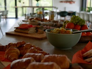 Enjoy a delicious breakfast with a view of lush greenery from the comfort of your room.