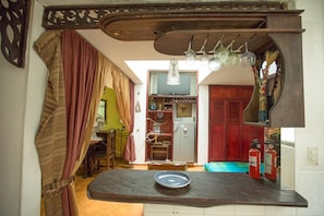 Enjoy cooking in this well-equipped kitchen with a central island and dining area nearby.