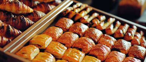 A variety of baked goods including pastries and bread.