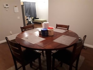 Enjoy meals in this cozy dining area with a round table and four chairs.