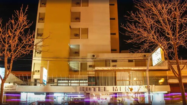 A hotel with a sign reading "HOTEL MILES" and a visible entrance. - Hotel Menossi (Rio Cuarto)