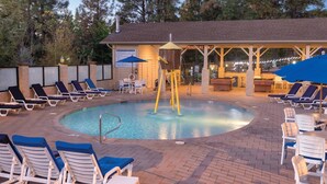 A pool area with lounge chairs, a hot tub, and a covered seating area. - Luxurious Mountain View Golf Resort with tons of Amenities (Flagstaff)