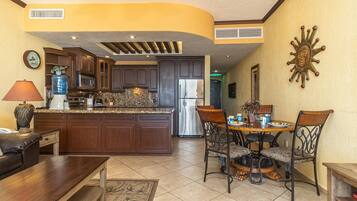 Coffee/tea maker, fridge, microwave, oven