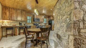 Cabin, Multiple Beds, Hot Tub | Private kitchen | Fridge, microwave, stovetop, dishwasher