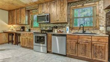 Cabin, Multiple Beds, Hot Tub | Private kitchen | Fridge, microwave, stovetop, dishwasher