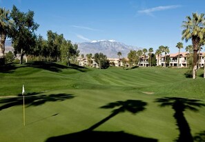 Enjoy a round of golf amidst lush greenery and scenic views of the surrounding mountains.