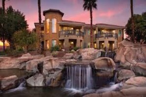 Experience the tranquil atmosphere of this hotel, surrounded by lush gardens and a serene waterfall.