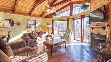 Cabin, Multiple Beds, Hot Tub | Living room | 42-inch TV with cable channels, fireplace, MP3 dock