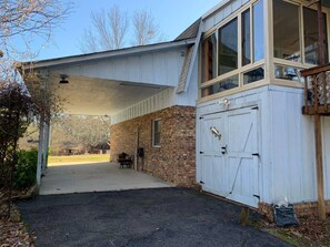 A two-story building with a covered porch and a garage. - QUIET PRIVATE BLUFF TOP HIDEAWAY, CLOSE TO EVERYTHING (Guntersville)