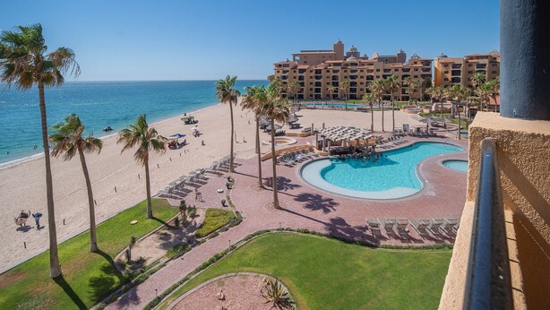 A resort with a pool, beach, and ocean view. - Princesa Resort E-408 Relaxation Clean Great Ocean Front Condo (Puerto Peñasco)