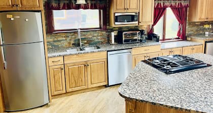 Wooded cabin in the Laurel Highlands with beautiful yard and native trout stream